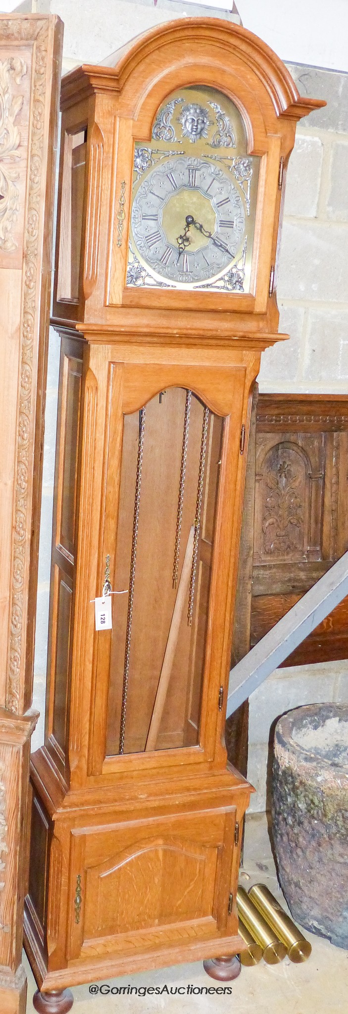 A reproduction oak longcase clock, height 210cm